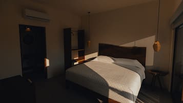 Una camera da letto moderna con un letto grande, una testiera in legno, un comodino e una lampada a sospensione.