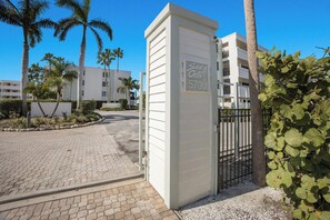 A gated entrance to a building with a sign indicating 'Sea Oats 5700'. - Sea Oats 336 | 2BR/2BA Boca Grande Gulf View (Boca Grande)