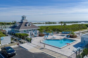 A hotel with a pool, a dock, and a view of the water. - Boca Grande North 17 - First Floor- Beachside-BayView - Commerical Ice Maker - Dock 44/46 for Rent! (Boca Grande)