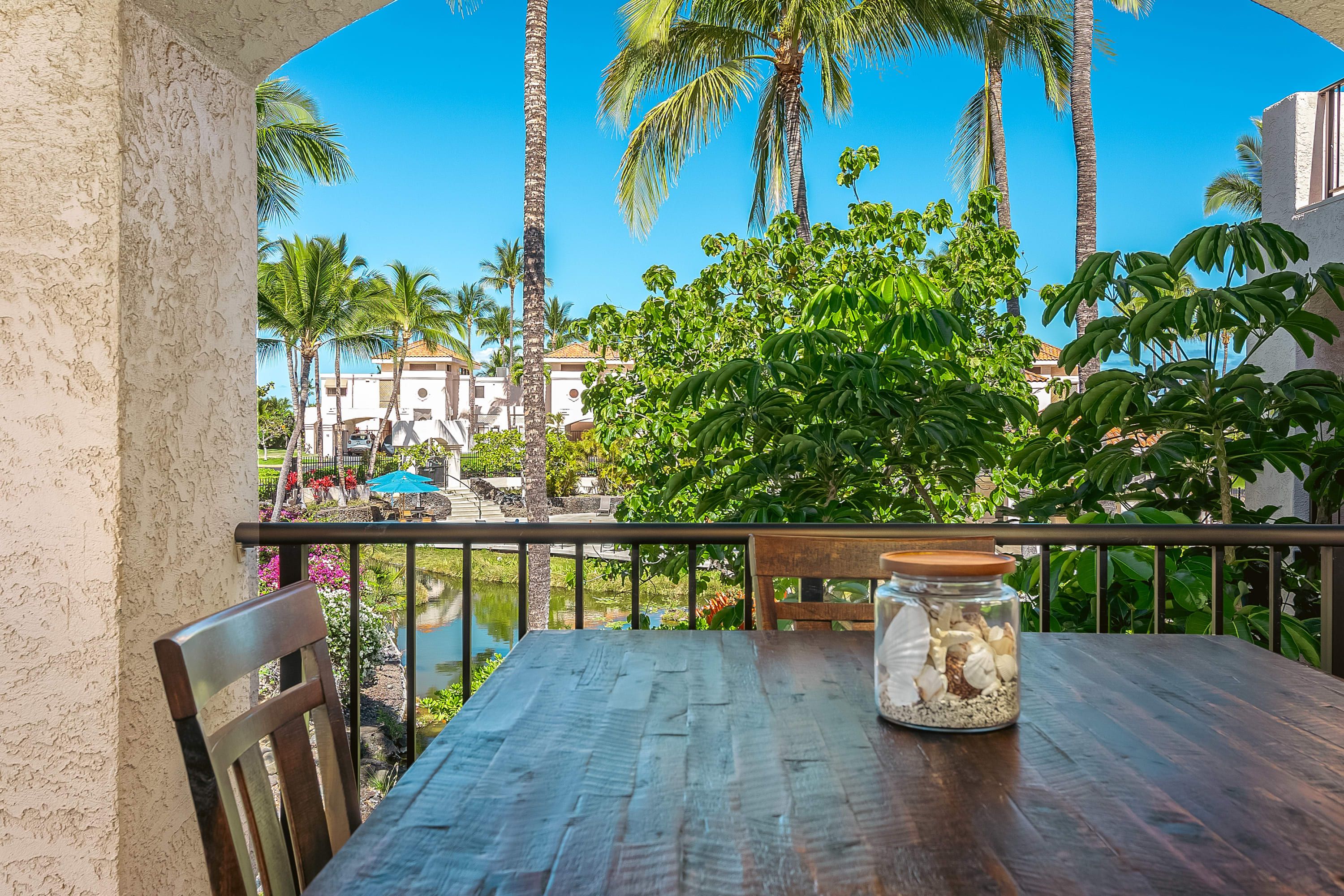 Oversized wrap-around lanai has resort views and gives a tropical vibe. Yours to enjoy are loungers, seating area, wet bar, as well as a bar-high table overlooking the resort pool. 