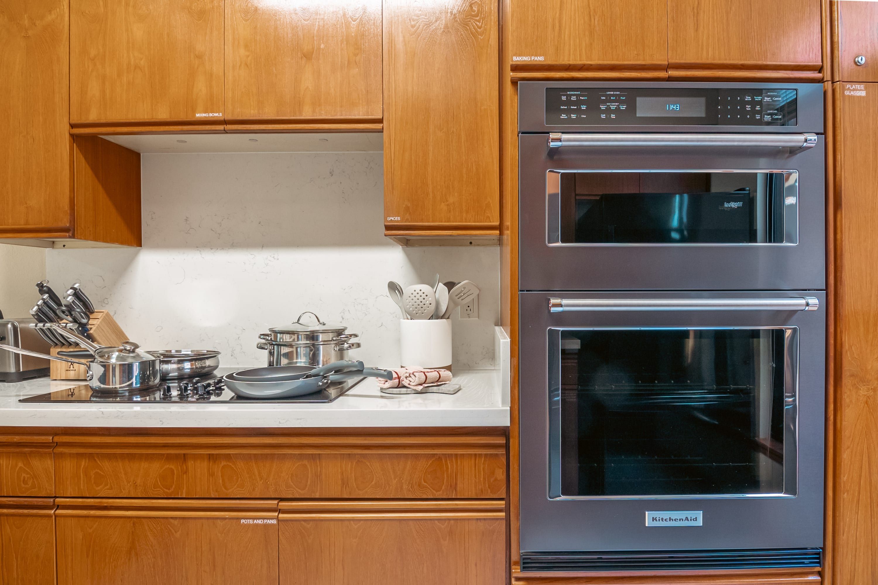 Fully stocked kitchen with modern appliances and a dining area that opens to the lanai with additional seating.  Whether you’re preparing island-inspired meals or enjoying takeout, everything you need is at your fingertips.
