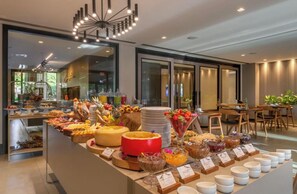 A buffet with various food items and a modern interior design. - Vrbo Property (Gramado)