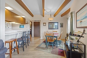 A modern interior with a kitchen, dining area, and a living space. - Lake Dillon and Mountain Views! (Dillon)