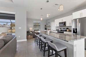 Fully equipped kitchen overlooking living room and dining area. Kitchen island seats 4 - Elegant House in Punta Gorda with Private Backyard, 5924 (Charlotte County)