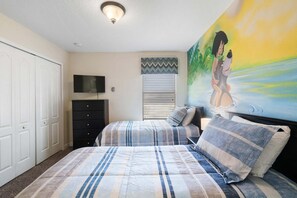 A bedroom with two beds, a TV, a dresser, and a painting on the wall. - Stunning Family Home in Davenport City, 6698 (Orlando)