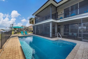 Sparkling pool overlooking the water. Pool size; 27' 12' x 5.5' - Modern Oasis in Port Charlotte, 5940 (Charlotte County)