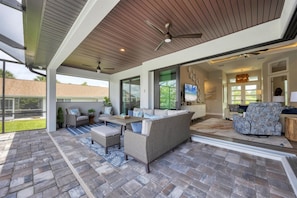 Fantastic outdoor living space overlooking the sparkling pool and canal beyond. Pool size: 24'x12'x6' - Serene Living in Port Charlotte, 5937 (Charlotte County)