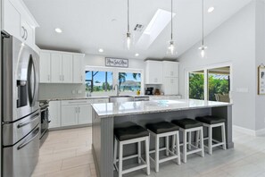 Beautiful, bright, fully-equipped kitchen with huge pass-through window - Serene Retreat in Punta Gorda - A 4 Bedroom Sanctuary 5953 (Charlotte County)
