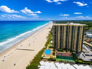 A beachfront hotel with a pool, tennis court, and beach access. - Oceanfront Maisons Sur Mer | Amazing Ocean Views (Myrtle Beach)
