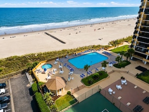 A resort with a swimming pool, beach access, and a view of the ocean. - Oceanfront Maisons Sur Mer | Amazing Ocean Views (Myrtle Beach)