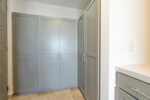 A room with a grey wardrobe, a white countertop, and a tiled floor. - A 100% Private Home for Family and Friends (San José del Cabo)
