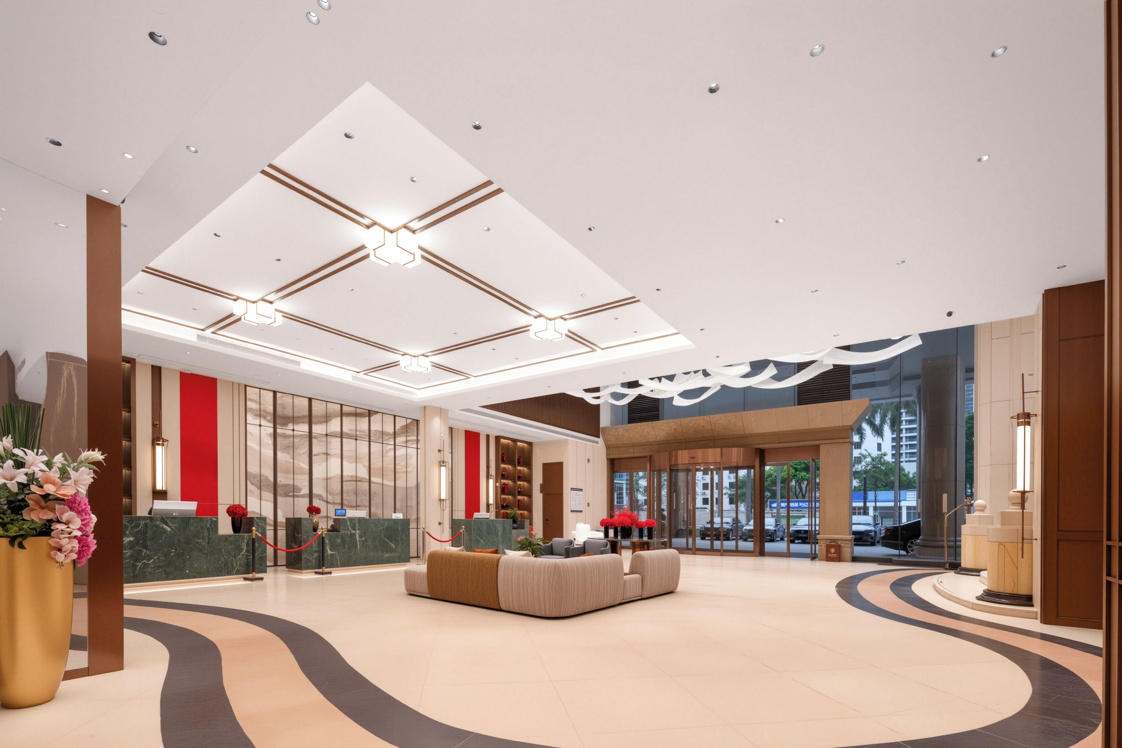 Eine geräumige Lobby mit hoher Decke, einem Empfangsbereich, einer Sitzecke und Blick durch große Fenster nach draußen.