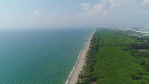 An aerial view of a coastal area with a beach and adjacent green land. - Mobile home with air conditioning, terrace and pool (Eboli)