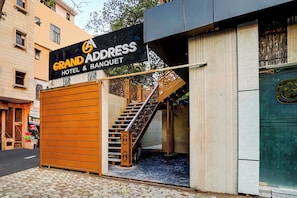 A hotel entrance with a sign reading 'Grand Address Hotel & Banquet.' - Townhouse GRAND ADDRESS HOTEL  (Ghaziabad)