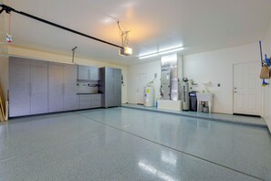 A spacious, well-lit kitchen with modern appliances and cabinets. - Desert Hills Fenced Acre! Pool, Spa + Dogs Allowed (New River)