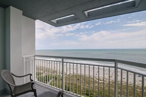 A balcony with a view of the beach and ocean. - Ocean-View Dunes Village Condo: Water Park & Pools (Myrtle Beach)
