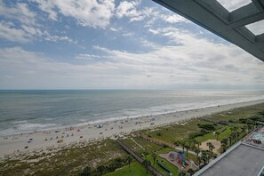 A beach with a wooden walkway and a playground. - Ocean-View Dunes Village Condo: Water Park & Pools (Myrtle Beach)
