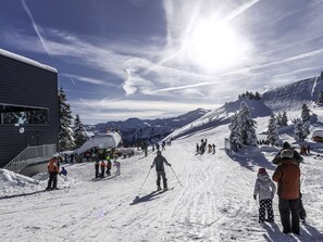 A ski resort with a chairlift, snow-covered slopes, and a mountain backdrop. - Marchegg by Interhome (Auffach)