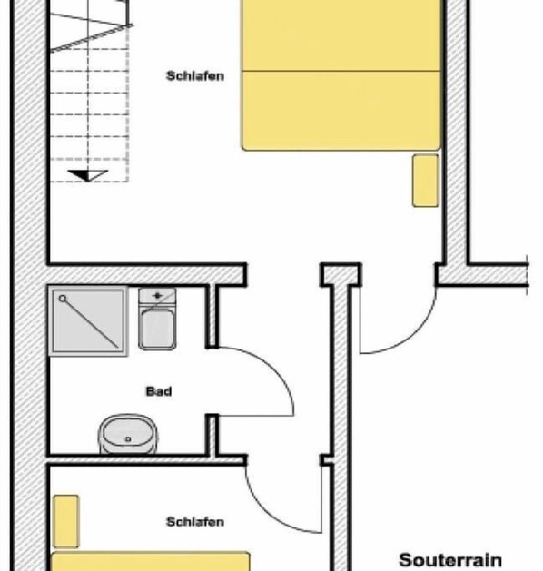 Ein Grundriss mit zwei Schlafzimmern, einem Badezimmer und einem Wohnbereich.