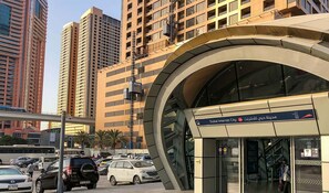 A modern building with a curved entrance and a sign indicating it is part of Dubai Internet City. - Separate Partition Room in Tecom  (Dubai)