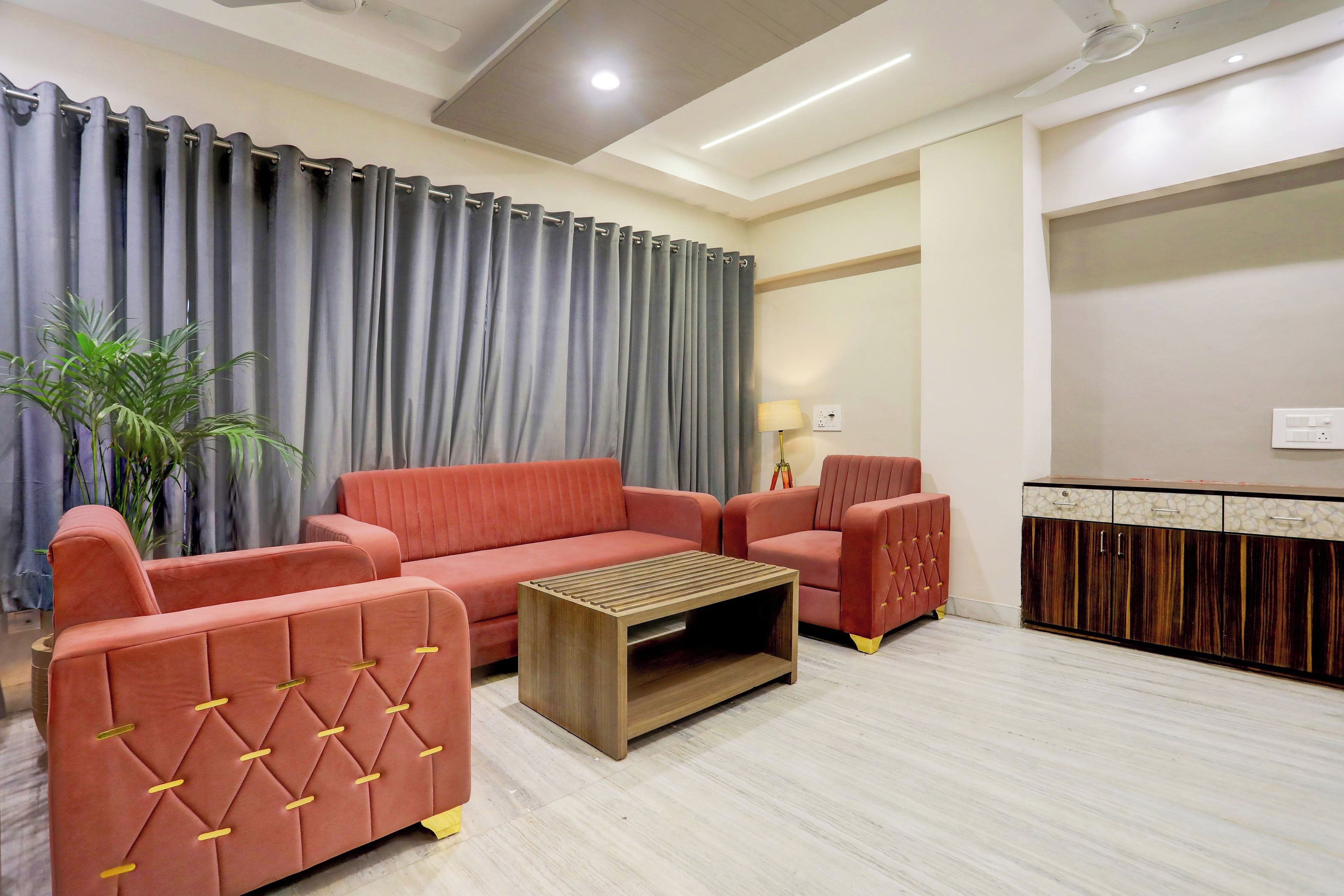 A modern living room with a sofa, armchair, and coffee table.