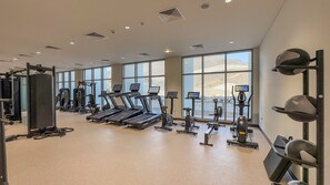 A gym with treadmills, weight machines, and exercise balls. - Stunning Gulf of Oman Views, 2BR with Assistant Room, Private Beach Access (Khor Fakkan)