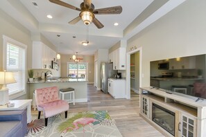 A spacious kitchen with white cabinets, a central island, and a built-in oven. - 2-unit Ocean Isle Beach Getaway Near Pier & Dining (Ocean Isle Beach)