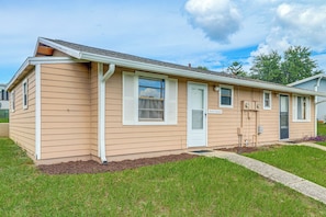 A single-story house with a front door, a window with shutters, and a small porch area. - 'lake Life' Retreat in Clermont w/ Pool & Pier (Clermont)