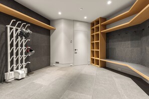 A modern bathroom with a shower area, a towel rack, and a vanity with a mirror. - Just Listed: New Ski Residence, Views, Gym, Hot tub (Whistler)