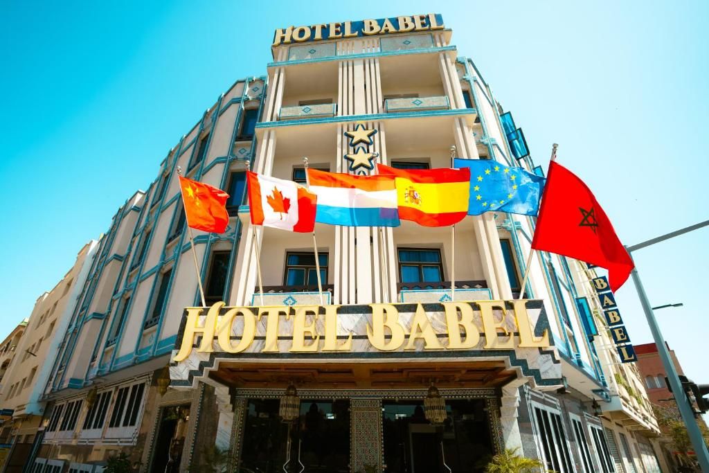 The exterior of Hotel Babel with its name prominently displayed.