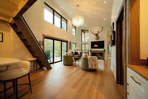 Living Room: Enjoy sweeping views and modern elegance with plush seating and natural light!