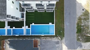 An aerial view of a residential property with a swimming pool, a covered patio, and a garage. - Ocean Views • Private Pool and Spa • 15 Sleeping Rooms • Sleeps 40 (North Myrtle Beach)