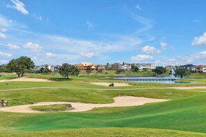 Championship Golf Course — Beautiful, sprawling views of manicured greens, sand traps, and tranquil water features right nearby. - New 5BR Reunion Villa, Themed Rooms, Resort Pools (Kissimmee)
