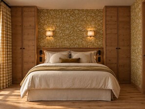 A bedroom with a large bed, wooden wardrobe, and patterned wallpaper. - Renovated apartment near slopes - 6 guests (Méribel)
