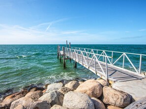 A pier extending into a body of water with a clear sky above. - 5 Person Holiday Home in Laeso (Læsø)