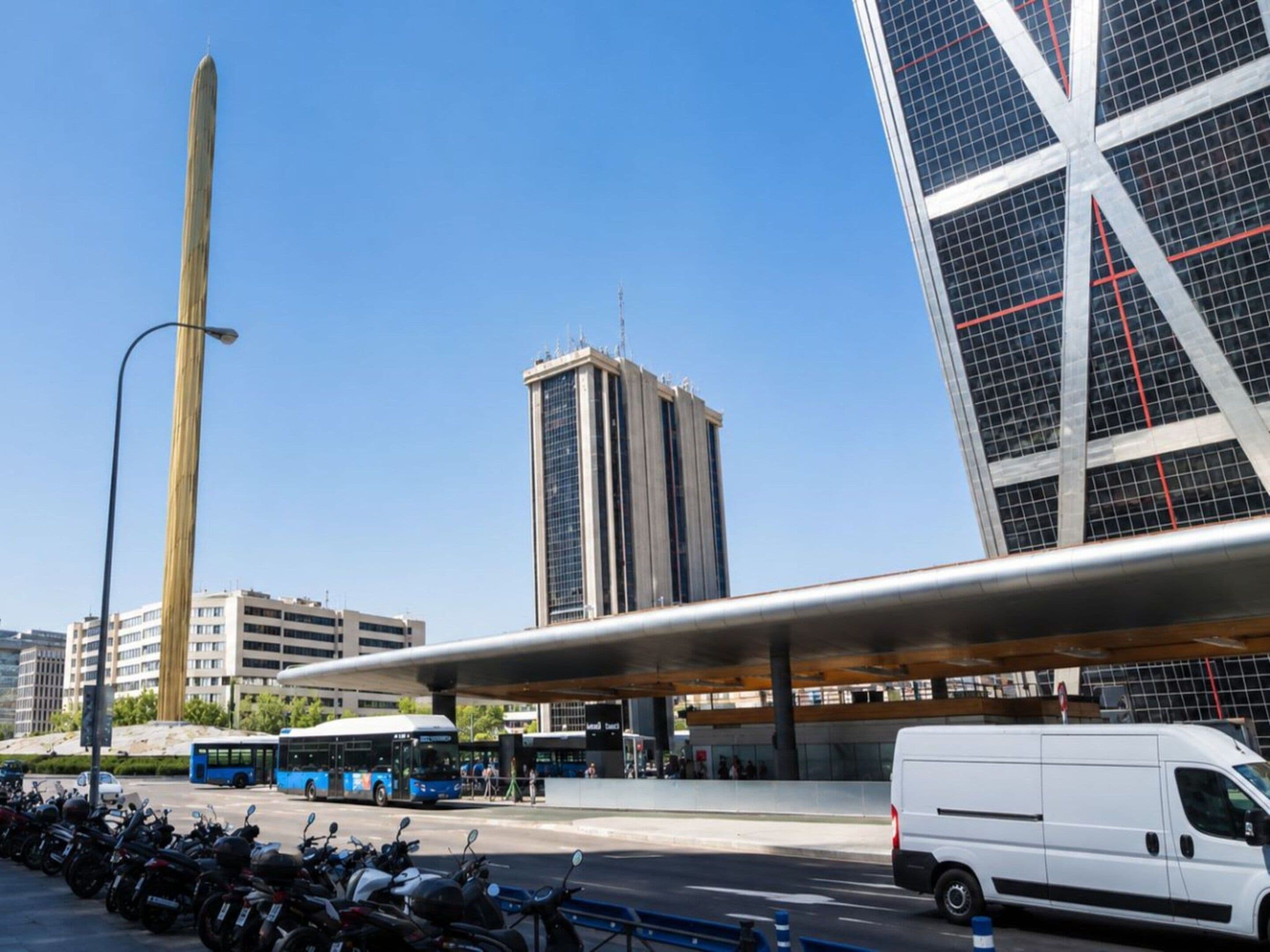 A modern urban street scene with a bus, a white van, and a row of parked motorcycles.