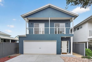 A two-story residential building with a garage, a balcony, and a small front yard. - 9 Barbara Street, Port Elliot Near Horseshoe Bay & Greenbay (Port Elliot)
