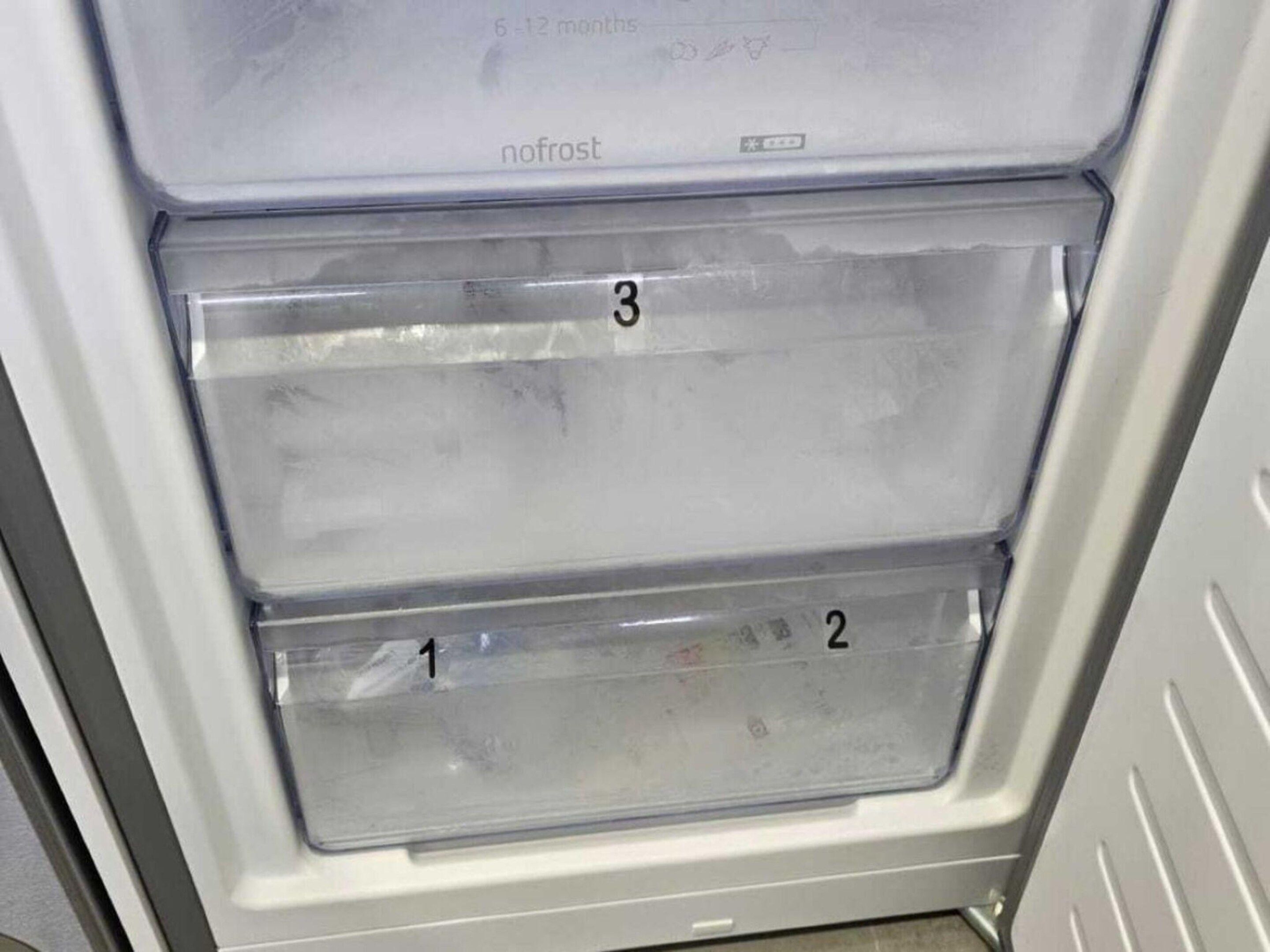 A refrigerator with two transparent drawers, labeled 1 and 2, and a third drawer labeled 3.