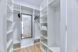 Walk-in closet with shelves, hangers, full-length mirror, iron and towels - Westmount Gem 3BR • A/C • Wi-Fi • Laundry Inside • Near Metro & Parks (Westmount)