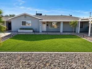 A modern two-story house with a well-maintained lawn and a gravel driveway. - Private Arcadia-Phoenix Escape with Resort-Style Backyard (Phoenix)