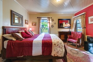 A bedroom with a large bed, a desk, a chair, and a television. - Cozy B&B Suite Near Finger Lakes & State Parks (Interlaken)