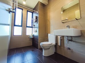 A modern bathroom with a toilet, sink, and shower. - Sky Loft at Midhills Genting by HCK (Genting Highlands)