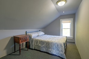A bedroom with a single bed, a nightstand, a window, and a ceiling light fixture. - Deck, Large Yard! Country Home in Mount Vision (Mount Vision)