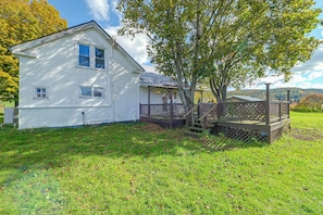 A white two-story house with a porch and a wooden deck. - Deck, Large Yard! Country Home in Mount Vision (Mount Vision)