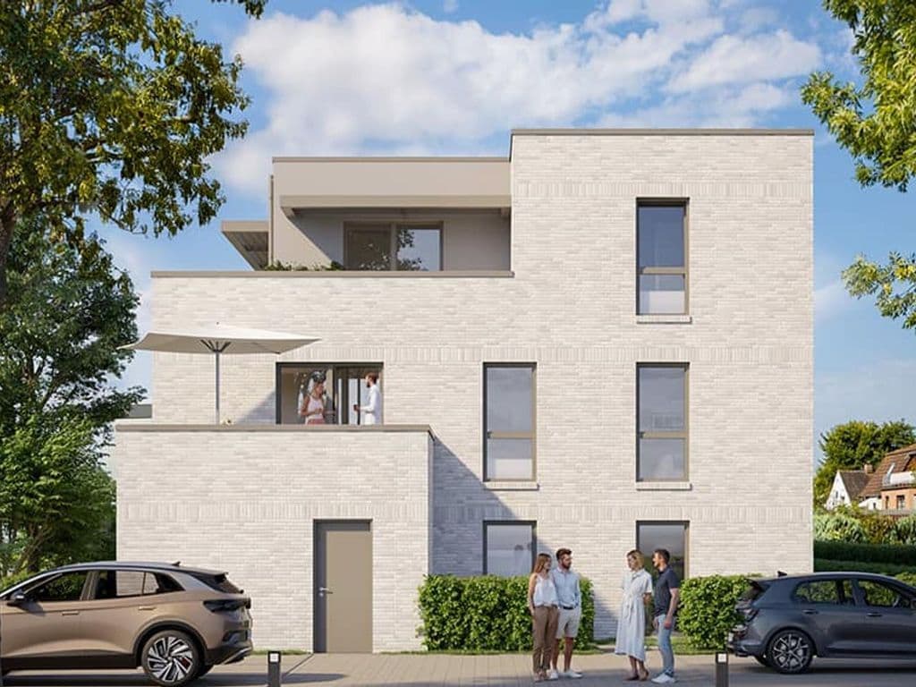 Een modern gebouw met meerdere verdiepingen, een plat dak, grote ramen en een zichtbaar balkon.