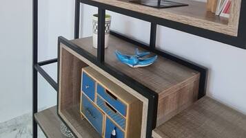 A multi-tiered shelving unit with various decorative items.