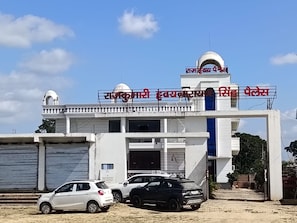 A building with a dome and a signboard. - Wishotel Resort Rajkumari Hridya Palace  (Padri Gajarat)