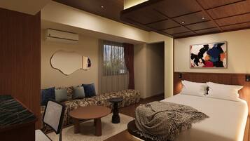 A modern hotel room with a bed, sofa, and a dining area.