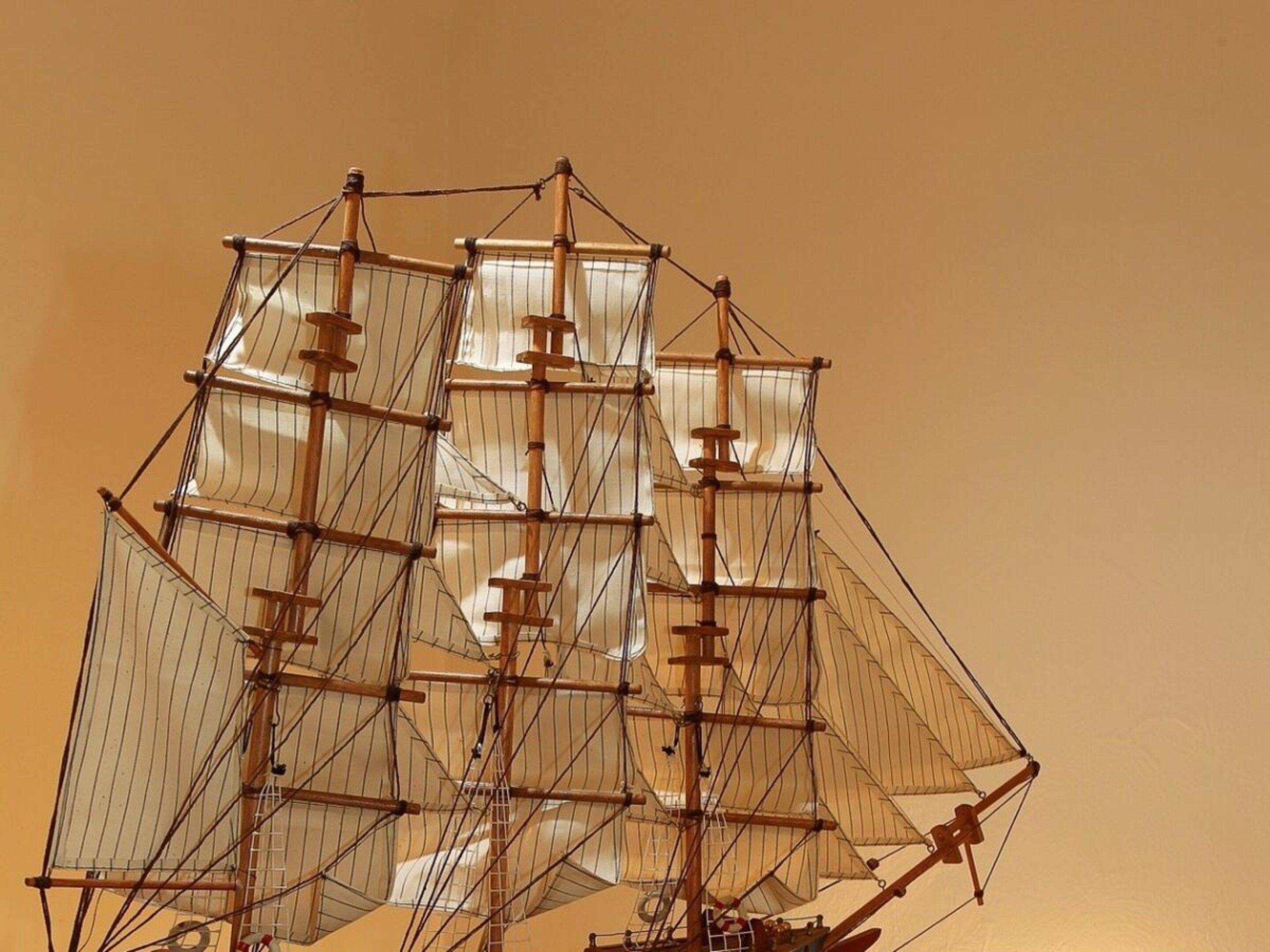 A model ship with multiple masts and sails.