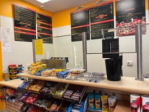 A breakfast counter with various food items and a coffee machine. - Condo in fantastic Las Vegas with pools, spas and National Rodeo Finals week. A. (Las Vegas)